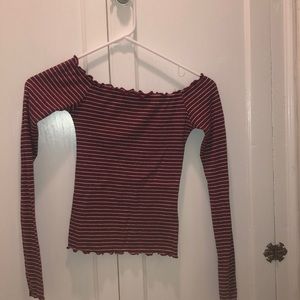Off the shoulder striped long sleeve shirt.